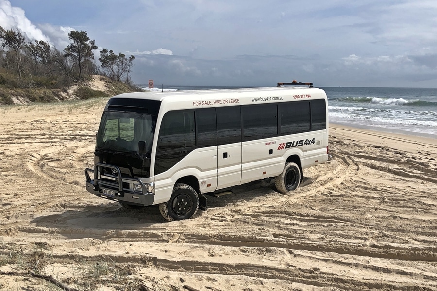 Toyota Coast on the beach | Featured image of the HiAce Accessories page for Bus 4x4 Group.